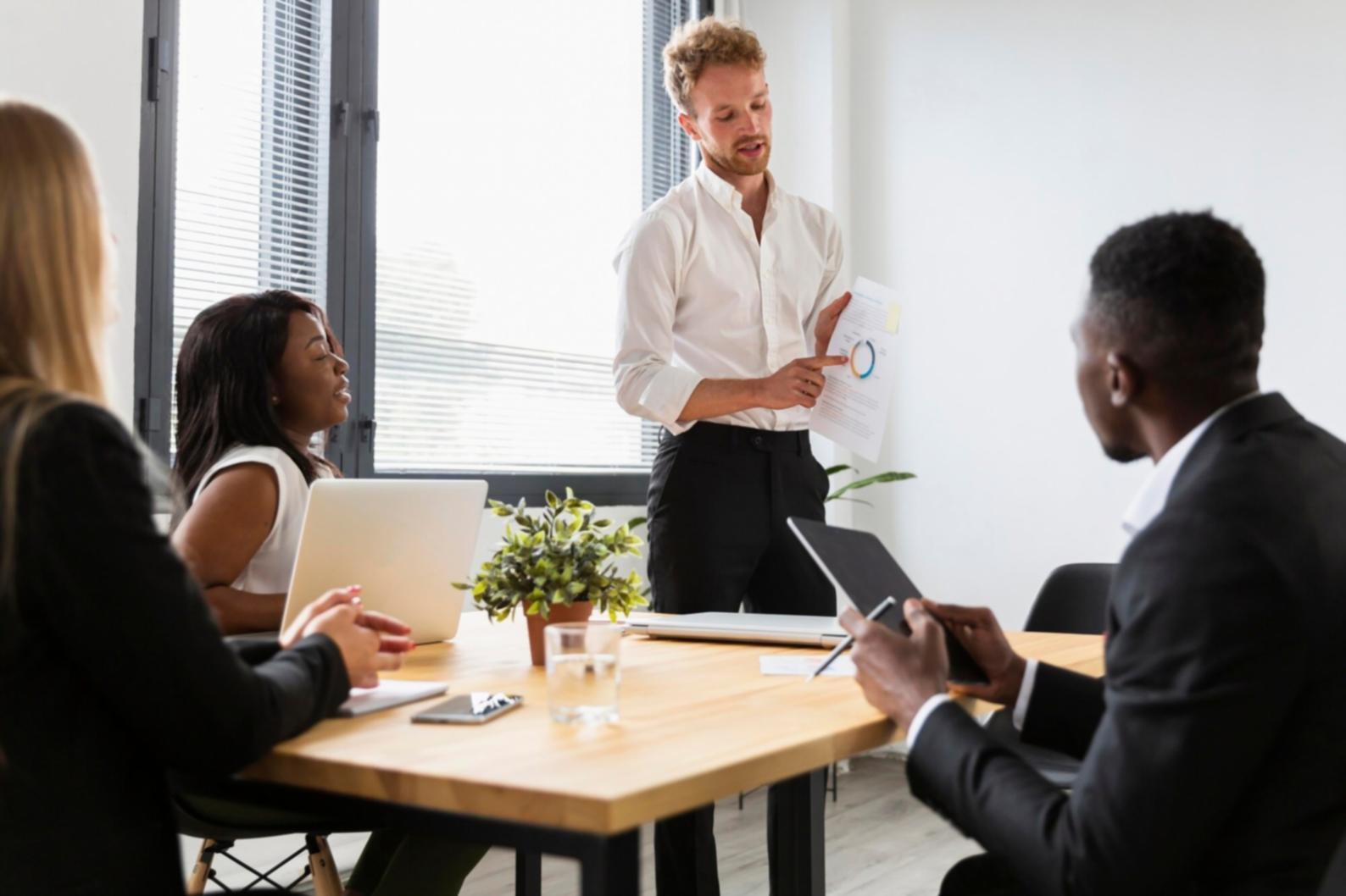 Executive reviewing financial reports and market analysis
